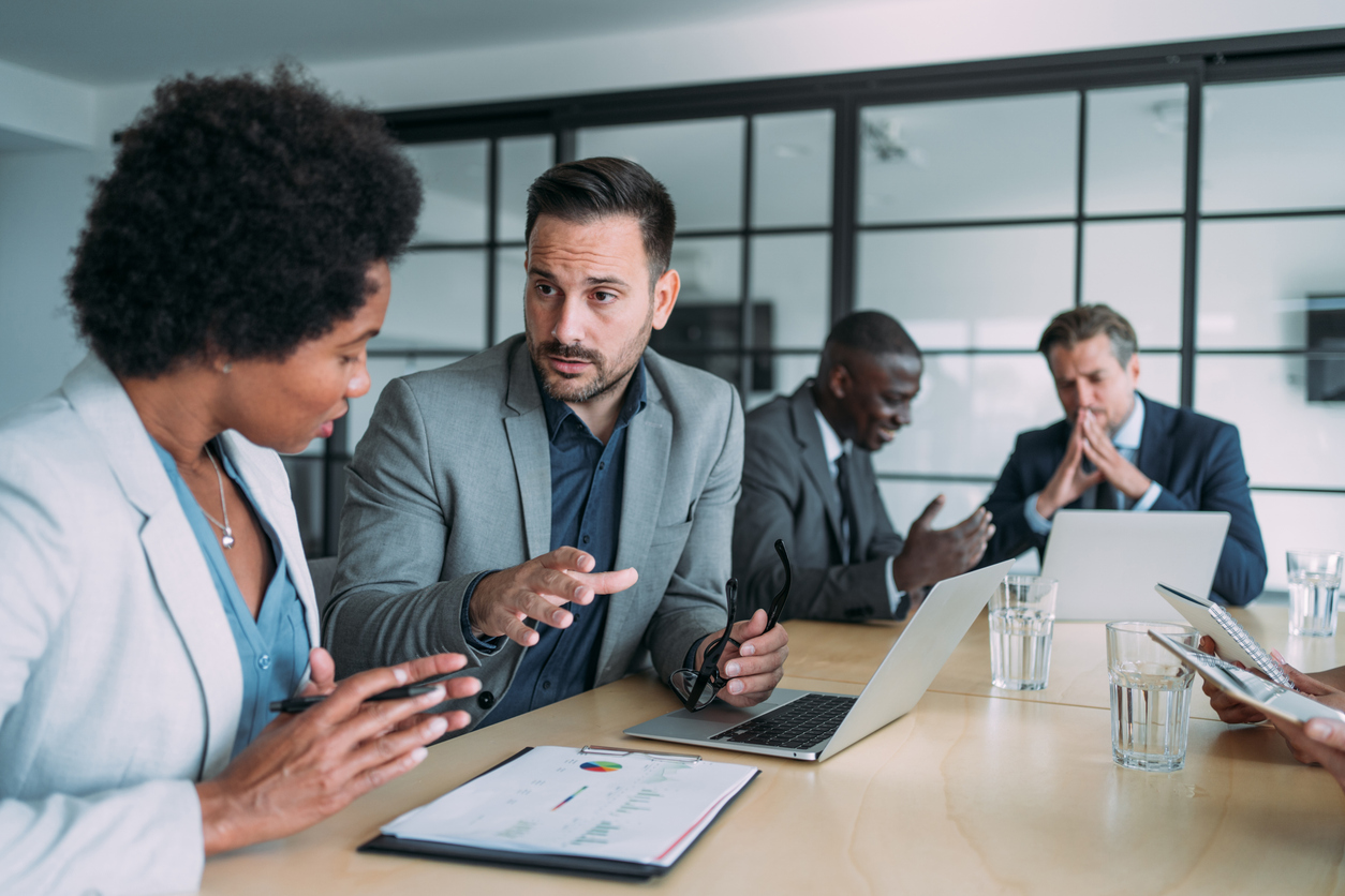 Group of business persons in business meeting. Group of entrepreneurs on meeting in board room. Corporate business team on meeting in the office.